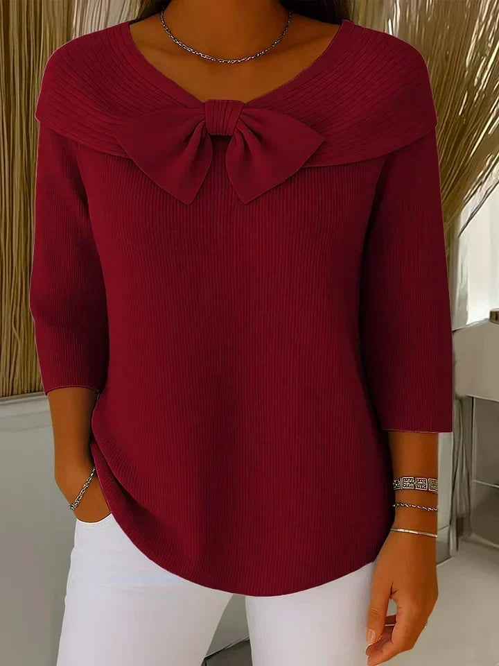 Tivella™ | Sweter z kokardą i okrągłym dekoltem" can be rewritten as:

"Tivella™ | Sweter z kokardą i dekoltem w kształcie koła