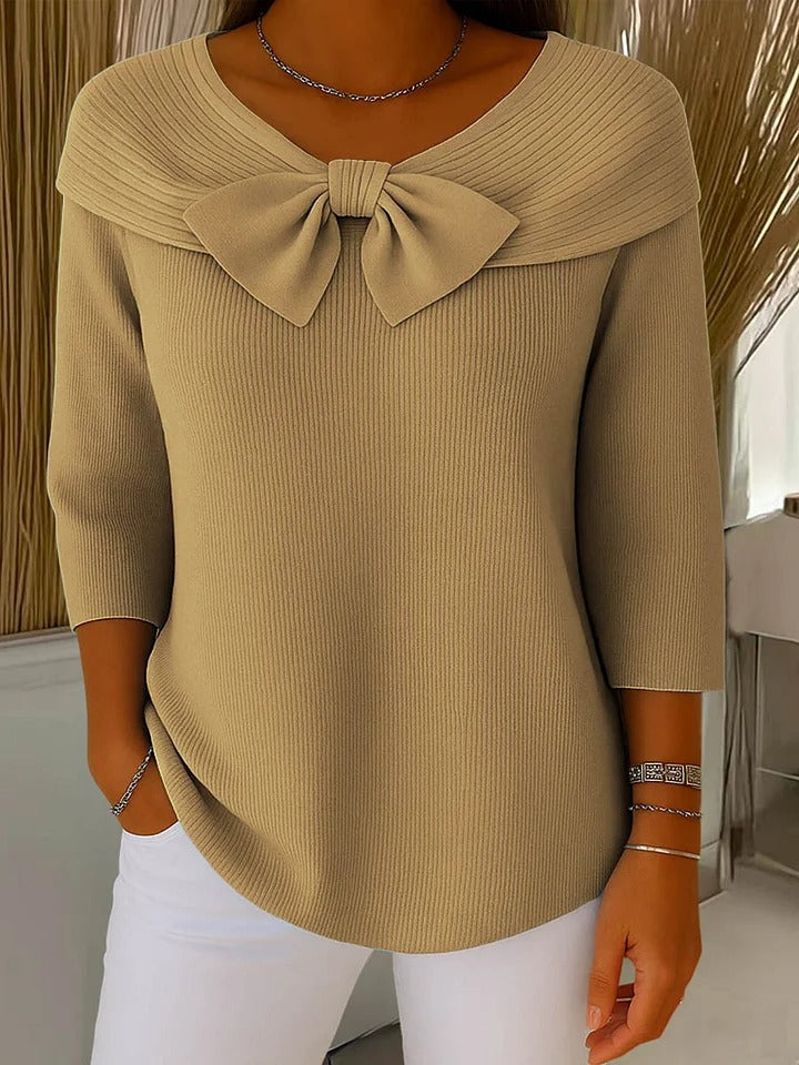 Tivella™ | Sweter z kokardą i okrągłym dekoltem" can be rewritten as:

"Tivella™ | Sweter z kokardą i dekoltem w kształcie koła